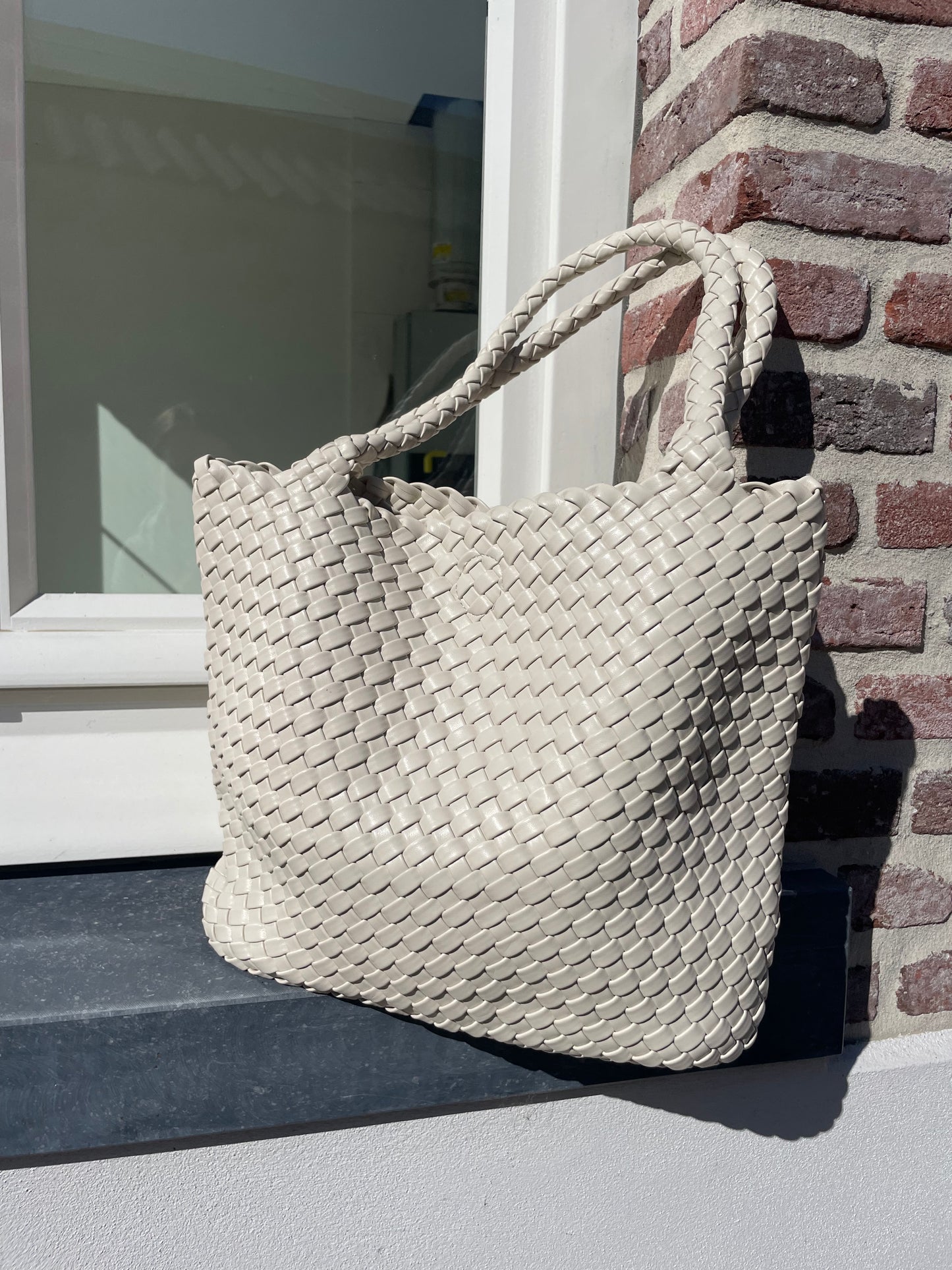 Gevlochten handtas beige