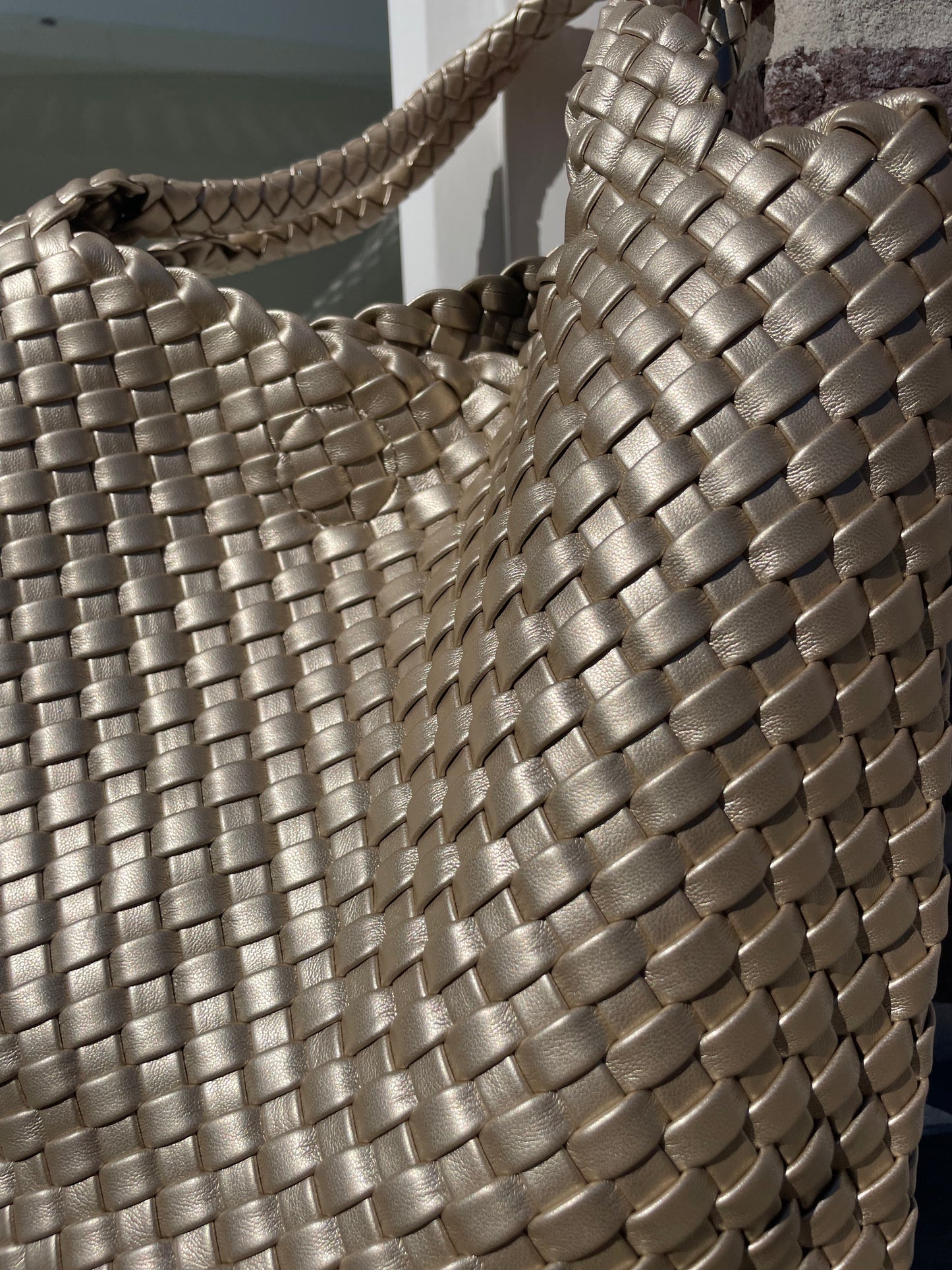 Gevlochten handtas goud